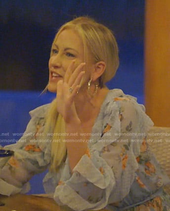 Stephanie’s blue floral ruffled romper on The Real Housewives of Dallas