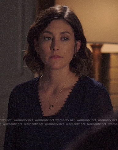 Sydney’s navy dotted blouse on Bluff City Law