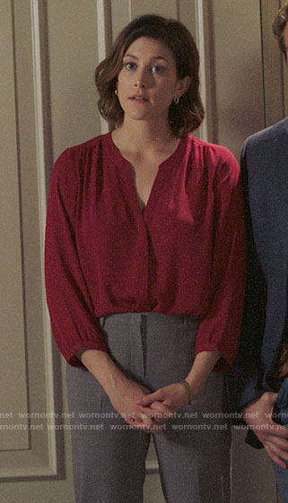 Sydney’s red split neck blouse on Bluff City Law