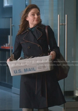 Taylor’s navy trench coat with piping trim on Bull