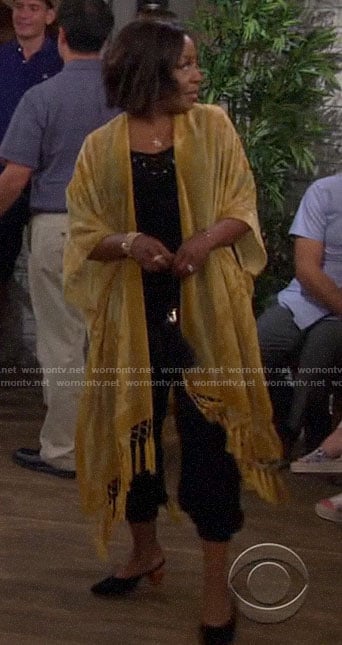 Tina’s sheer yellow floral kimono with tassel trim  on The Neighborhood