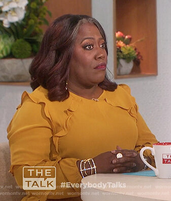 Sheryl’s mustard ruffle top on The Talk