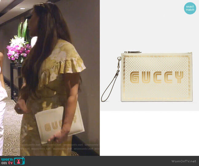 Gucci Star Print Guccy Clutch Bag worn by LeeAnne Locken on The Real Housewives of Dallas