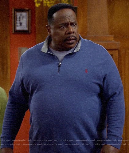 Calvin’s blue zip neck sweater on The Neighborhood