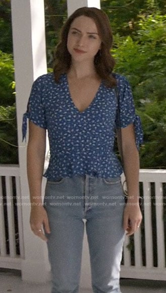 Cara’s blue floral tie-sleeve top on God Friended Me