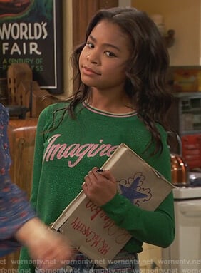 Nia’s green imagine sweater on Ravens Home