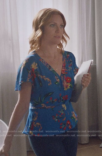 Julia’s blue floral v-neck top on Almost Family