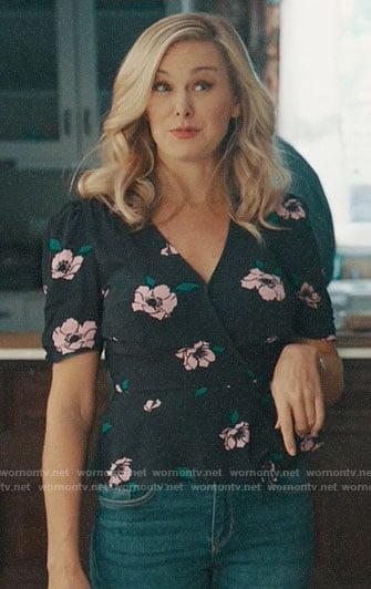 Kimmy’s black floral wrap top on Perfect Harmony
