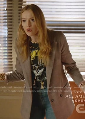 Kirby’s skull print tee and plaid blazer on Dynasty