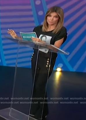 Kit’s navy pants with gold buttons on Access Hollywood