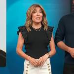 Kit’s black flutter sleeve top and white pants on Access Hollywood