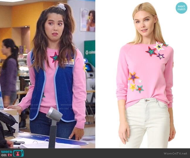 Mira Mikati Patched Star Sweater worn by Cheyenne (Nichole Bloom) on Superstore