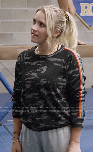 Roxy’s grey camo sweatshirt with rainbow stripes on Almost Family