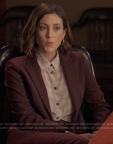 Sydney’s printed blouse and burgundy suit on Bluff City Law