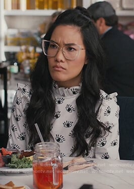 Doris’s white eye print ruffle blouse on American Housewife
