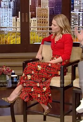 Kelly’s red v-neck sweater and printed skirt on Live with Kelly and Ryan
