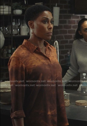 Lynn’s orange cloud print blouse on Black Lightning