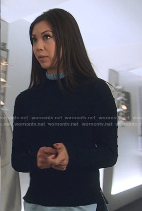 Tina’s navy frilled neck sweater on Marvels Runaways
