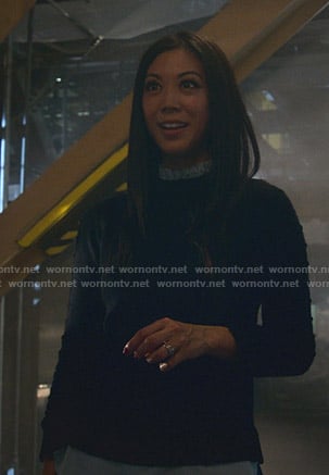 Tina’s navy frilled neck sweater on Marvels Runaways