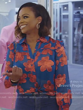 Kandi’s blue floral blouse on The Real Housewives of Atlanta