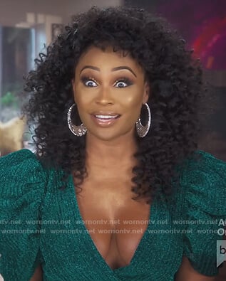 Cynthia’s green metallic puff sleeve romper on The Real Housewives of Atlanta