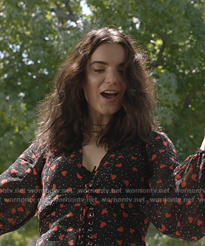 Megan’s black heart print lace-up top on Shameless