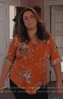 Katie’s orange blouse blouse on American Housewife