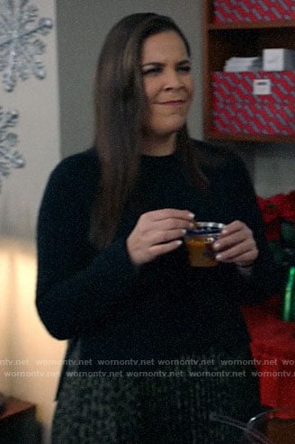 Sara’s black sweater and leopard print pleated skirt on All Rise