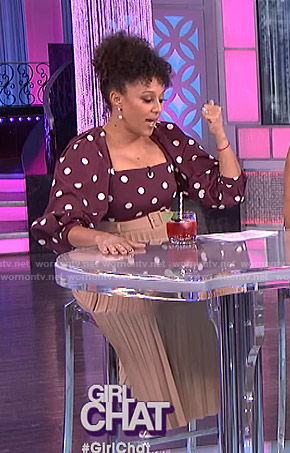 Tamera’s purple polka dot top and beige pleated skirt on The Real