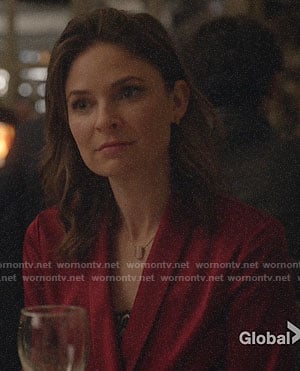 Taylor’s red wrap blouse on Bull