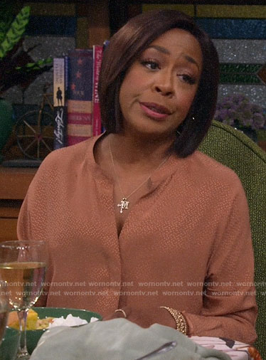 Tina’s dotted blouse on The Neighborhood