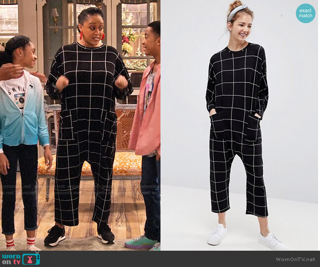 ASOS DESIGN Minimal jersey jumpsuit with batwing sleeve in check print worn by Cocoa McKellan (Tia Mowry-Hardrict) on Family Reunion