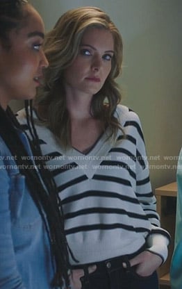 Sutton’s white striped v-neck sweater on The Bold Type