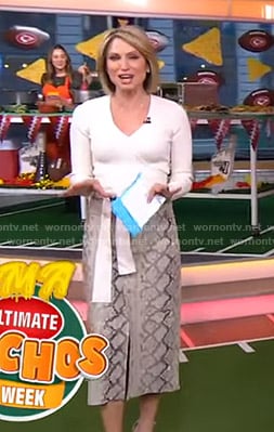 Amy’s white wrap knit top and snake print skirt on Good Morning America