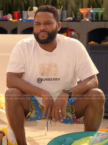 Andre’s Burberry graphic tee and blue printed board shorts on Black-ish