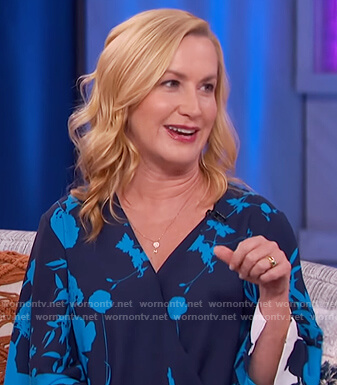 Angela Kinsey’s blue floral wrap top on The Kelly Clarkson Show