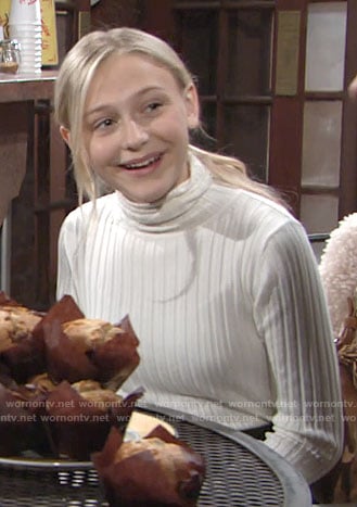 Faith’s white ribbed turtleneck sweater on The Young and the Restless