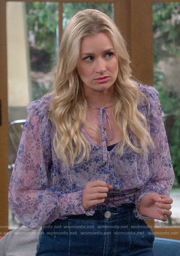 Gemma’s purple floral smocked blouse on The Neighborhood