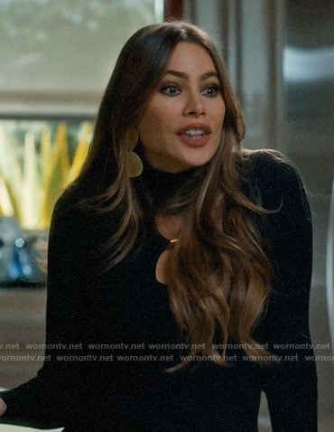 Gloria’s black double keyhole sweater on Modern Family