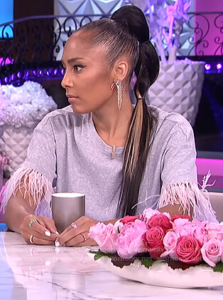 Amanda’s gray tee with feather trim sleeves on The Real