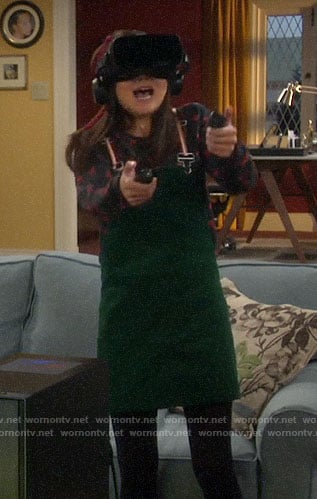 Jen’s green corduroy overall dress and cherry print sweatshirt on Last Man Standing