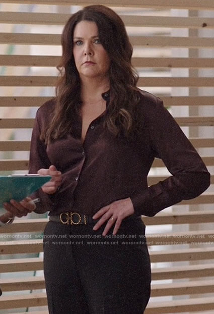 Joan’s burgundy satin shirt and rope buckle belt on Zoeys Extraordinary Playlist
