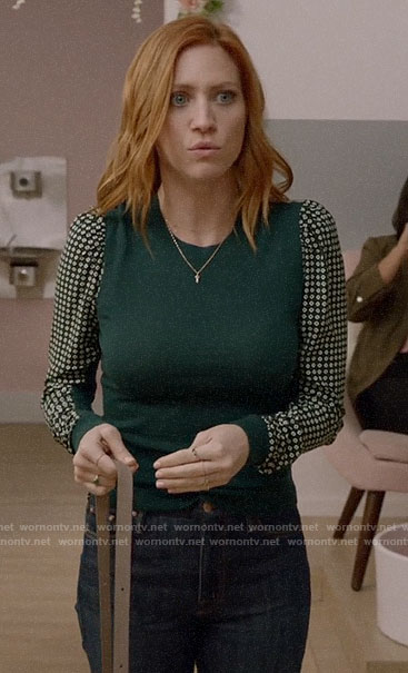Julia’s green printed sleeve sweater on Almost Family