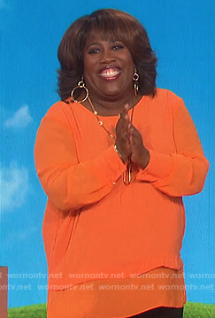 Sheryl’s orange layered top on The Talk