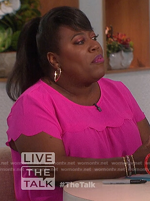 Sheryl’s pink scallop trim top on The Talk