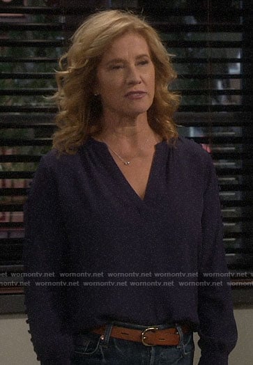 Vanessa’s navy buttoned sleeve blouse on Last Man Standing