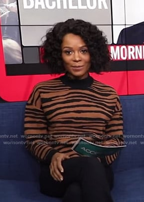 Zuri’s brown tiger print sweater on Access Hollywood