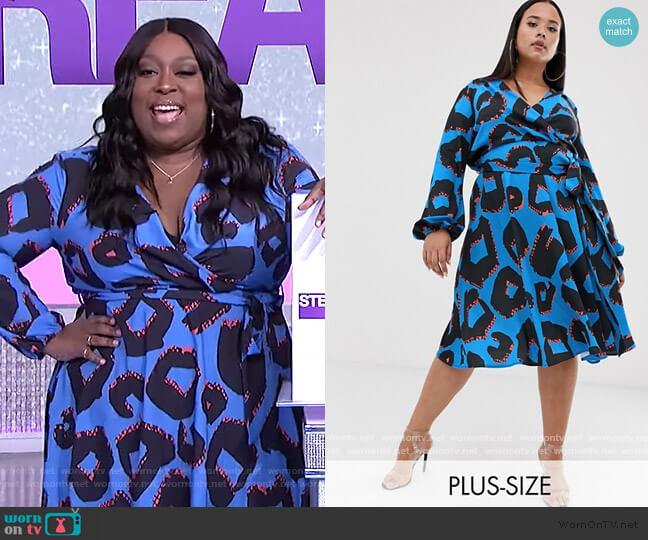 Flounce London Plus wrap front midi dress in abstract print worn by Loni Love on The Real