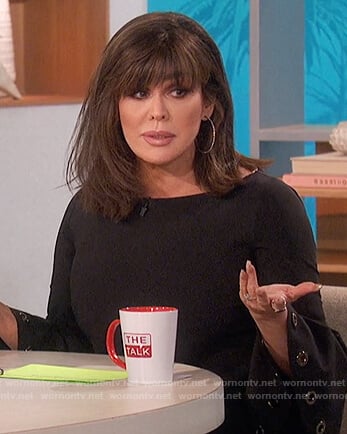 Marie’s black grommet bell sleeve top on The Talk