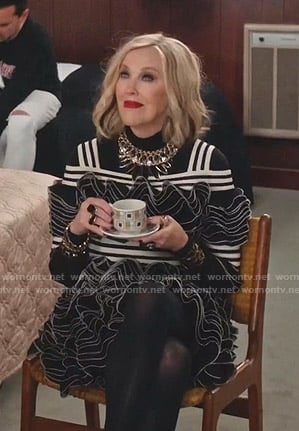 Moira’s black striped ruffle mini dress on Schitts Creek